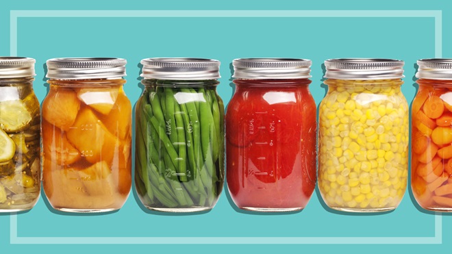 preserved and picked vegetables in glass preserving jars